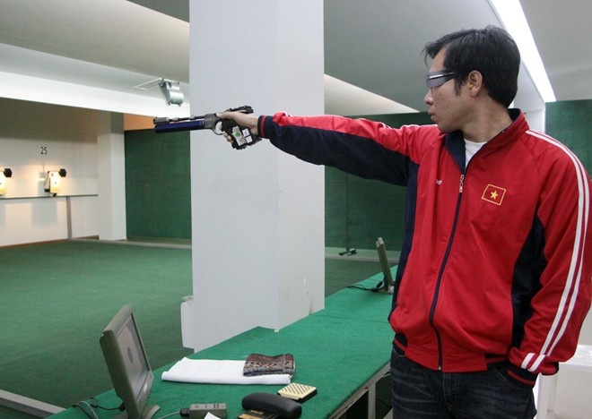 Hoang Xuan Vinh can nang van lap ky luc SEA Games hinh anh