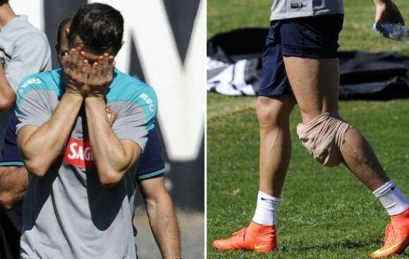 Ronaldo nhanh chóng rời sân với túi chườm đá ở đầu gối trong buổi tập mới nhất của tuyển Bồ Đào Nha.