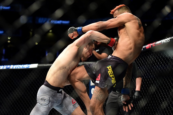UFC 27: Võ sĩ hạ gục đối thủ bằng cú đấm vào gan ảnh 6 UFC 27: Vo si ha guc doi thu bang cu dam vao gan anh 6