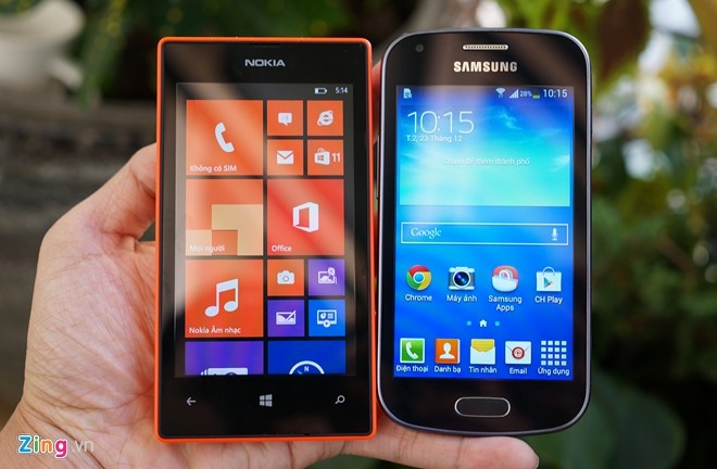 Nokia Lumia 525 (trái) và Samsung Galaxy Trend Plus - những sản phẩm đáng chú ý nhất ở phân khúc smartphone giá rẻ đầu năm 2014. Ảnh: Duy Tín.