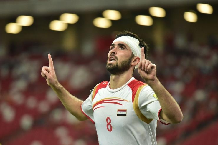 Bong da Syria troi day tu tang thuong va mat mat hinh anh