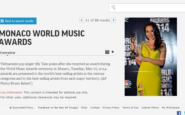 Hình ảnh Mỹ Tâm nhận cúp xuất hiện trê trang tin AP.