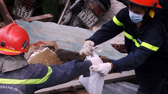 An tang hai nan nhan trong vu no kinh hoang o Sai Gon hinh anh