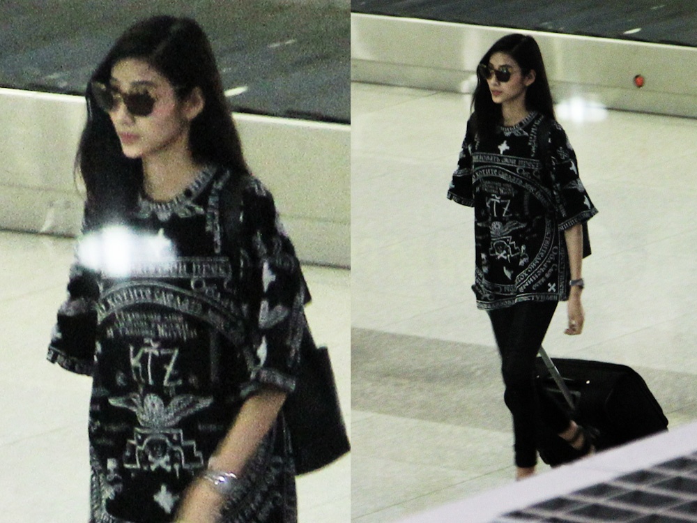 Hoang Thuy an van ca tinh o san bay Sai Gon ngay tro ve hinh anh