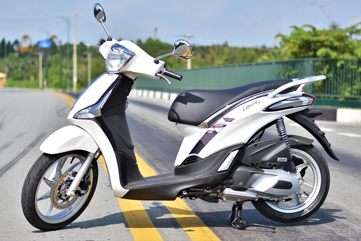 Co 50 trieu dong toi nen mua Yamaha Grande hay Piaggio Liberty cho vo? hinh anh