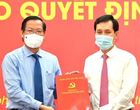 Chu tich UBND quan 10 lam Bi thu Dang uy Saigon Co.op hinh anh