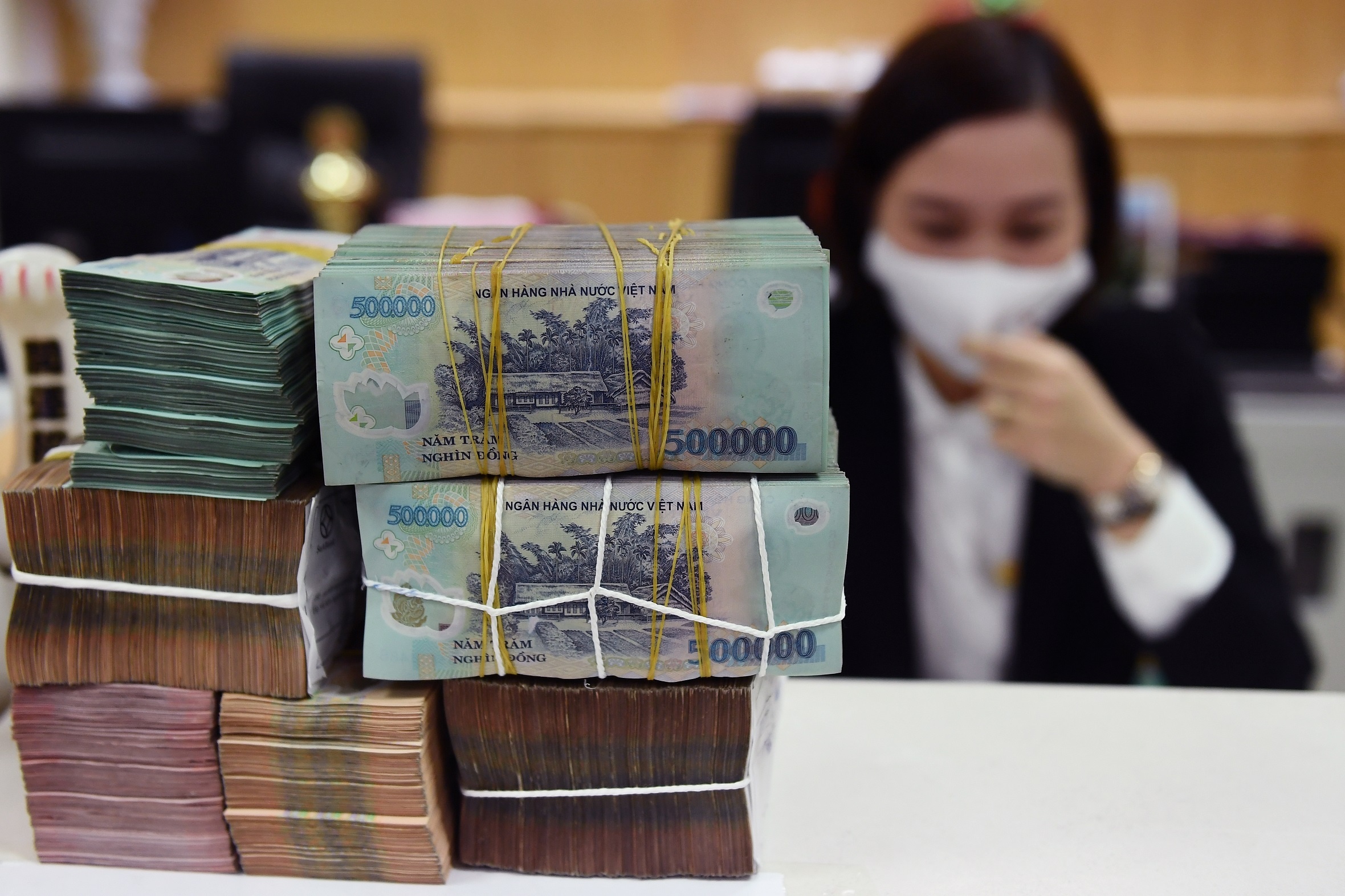 Chinh sach thang 12: Ngan hang pha san, bao hiem toi da 125 trieu dong hinh anh