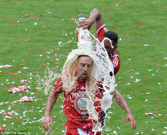 Soaking: Bayern's Franck Ribery of France gets a shower of beer