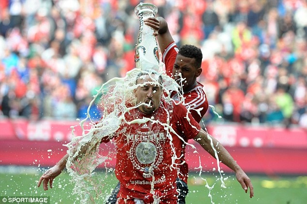 Wet: Ribery is drenched in the title celebrations 