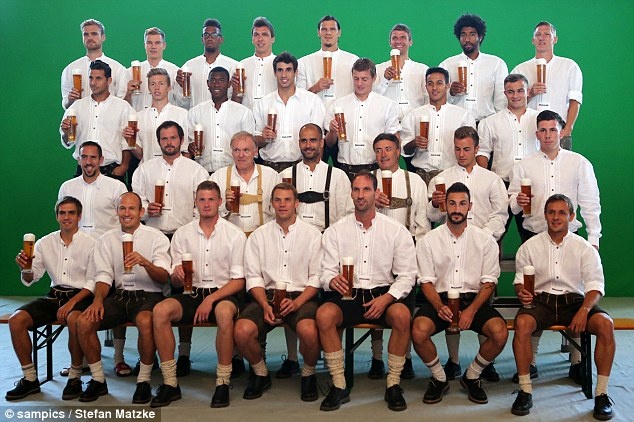 Team outing: Munich players and coaches line up ahead of their photo call for Oktoberfest