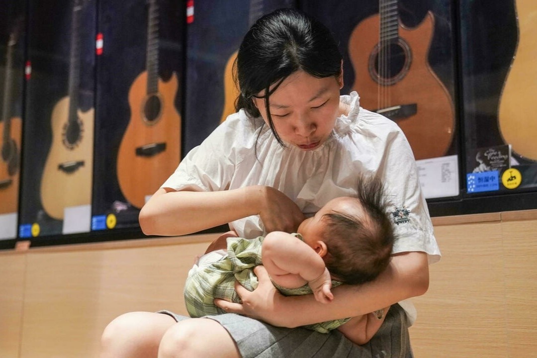 Me don than Trung Quoc bi bo roi trong chinh sach de 3 con hinh anh