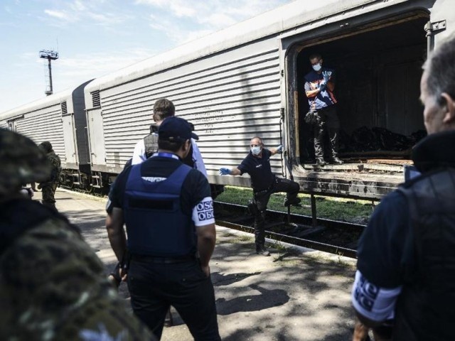 Phien quan giao thieu hon 80 thi the nan nhan MH17 hinh anh