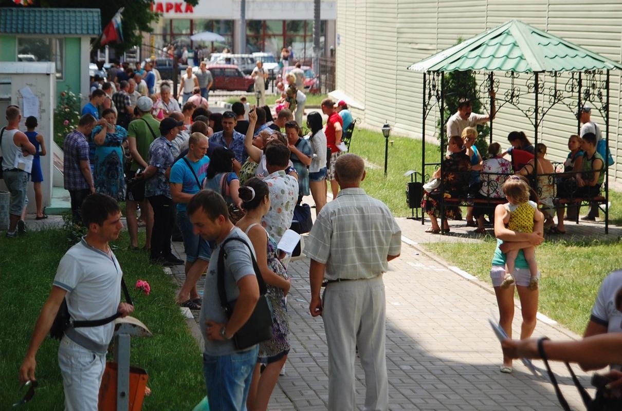 People gather outside an office of the Russian federal migration service in Belgorod, June 9, 2014. (REUTERS/Vladimir Kornev)