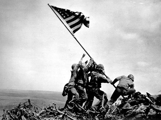 Ngày 26/3/1945, quân đội Mỹ chiếm ưu thế và kiểm soát đảo Iwo Jima trên lãnh thổ Nhật Bản. Sau khi chiếm được hòn đảo, người Mỹ đã biến nó thành một căn cứ không quân cho những chiếc khu trục cơ yểm trợ máy bay ném bom hạng nặng B-29 trút bom xuống các trung tâm công nghiệp trọng điểm trên lãnh thổ Nhật Bản và làm bàn đạp tấn công Tokyo. 