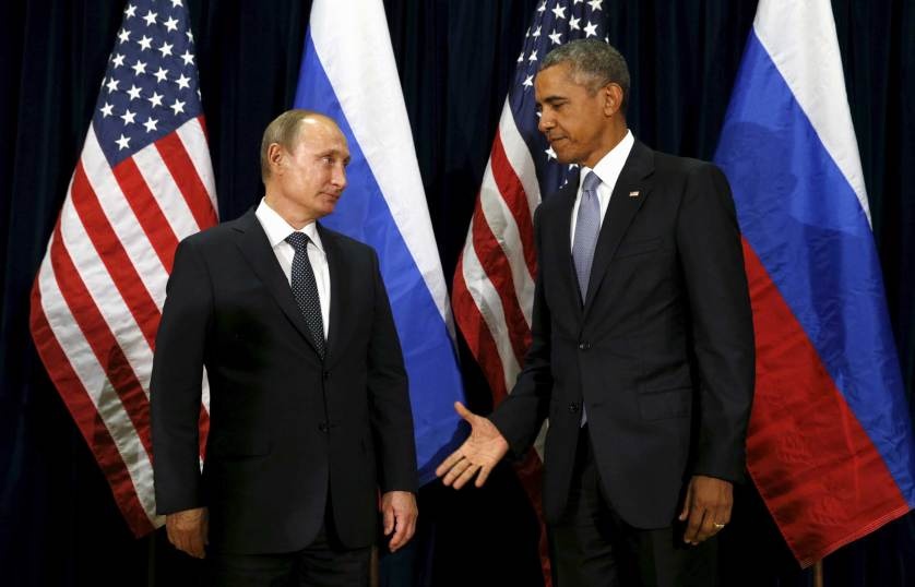  U.S. President Barack Obama extends his hand to Russian President Vladimir Putin during their meeting at the United Nations General Assembly in New York, N.Y. Sept. 28, 2015.