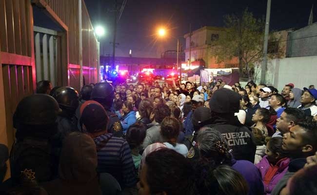 Bao loan o nha tu Mexico, 49 nguoi chet hinh anh