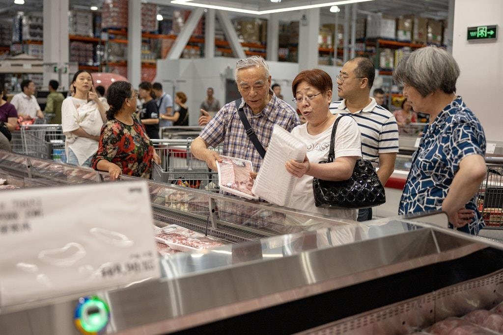 Kinh te lao dao, nguoi tieu dung Trung Quoc nhin an tieu hinh anh