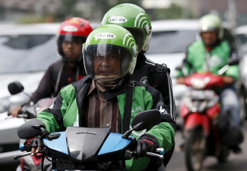 Cuoc chien dot tien, gom du lieu giua Grab va Gojek hinh anh