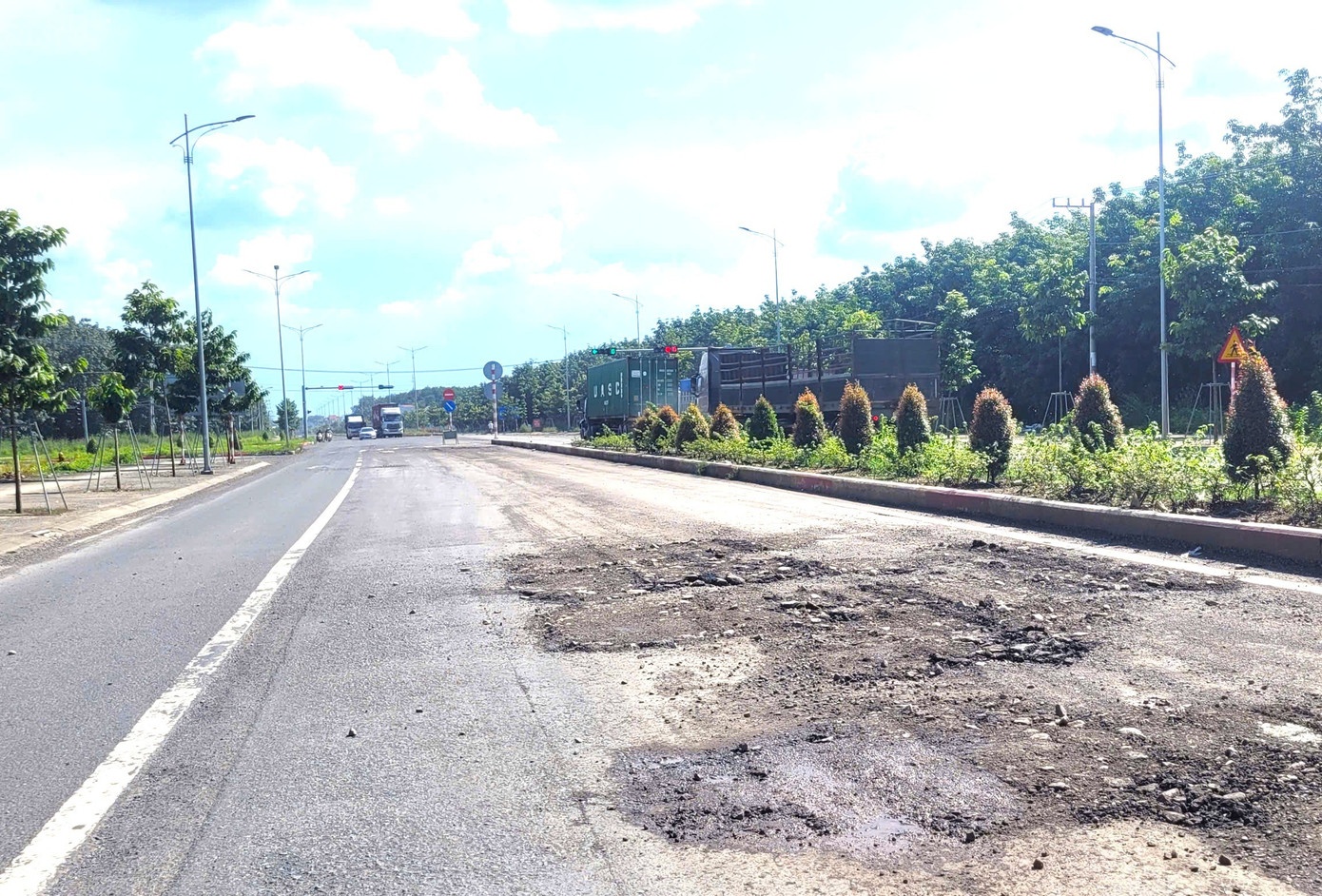 duong Bac Tan Uyen,  duong tp.hcm hong,  sua duong tp.hcm anh 2