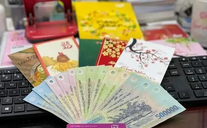 Nhan tien thuong Tet, co phai nop thue thu nhap ca nhan? hinh anh