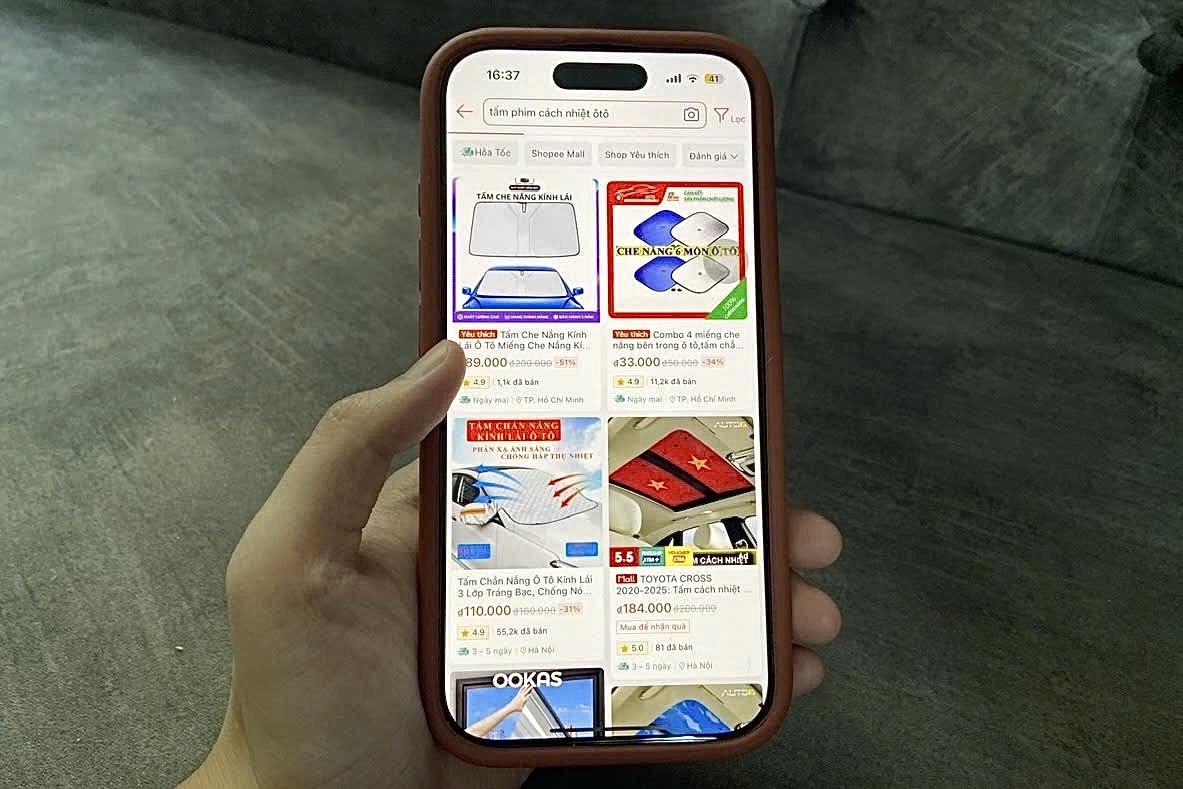 Nguoi dan tranh nong, sam thiet bi lam mat tren san thuong mai dien tu hinh anh