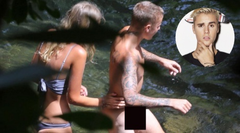 Justin Bieber khoa than ben ban gai moi khi du lich hinh anh