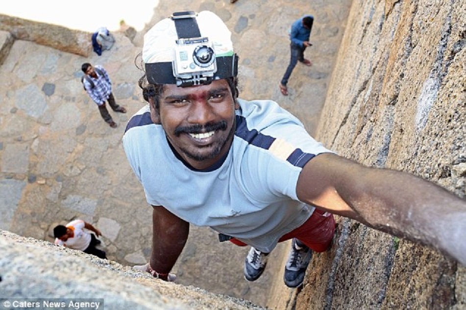Nguoi leo tuong bang tay khong nhu nhen hinh anh