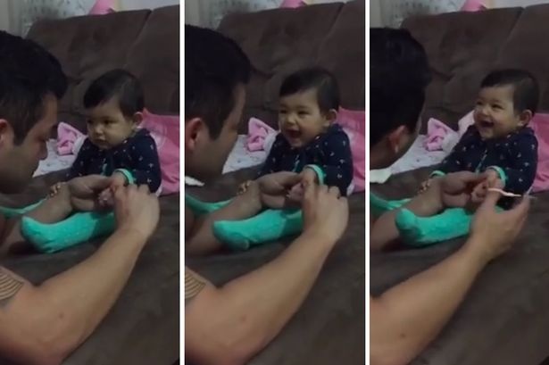 Be cuoi ngat ngheo khi bo cat mong tay hinh anh