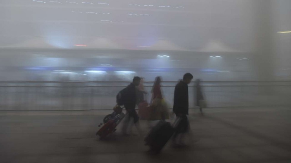 Trung Quoc hoan hang loat chuyen bay vi suong mu day dac hinh anh