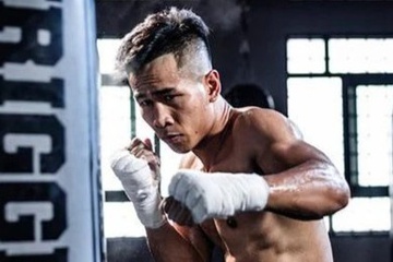 Tran Van Thao thang knock-out doi thu Thai Lan trong hiep 2 hinh anh