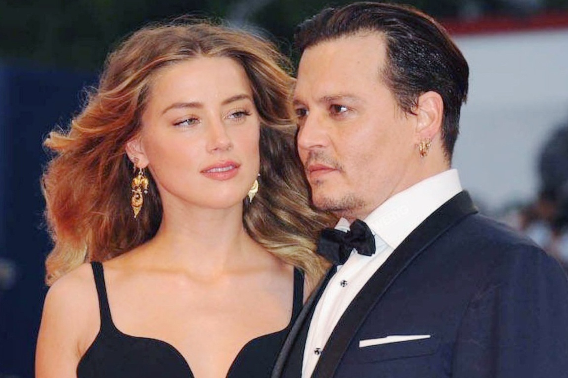Johnny Depp va Amber Heard dang trach hay dang thuong? hinh anh