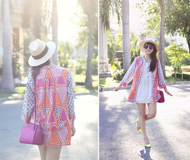  Linda Tran N, fashionista Sài Gòn thật độc đáo, nổi bật với chiếc áo trắng phom rộng, áo khoác họa tiết lạ mắt kết hợp nón cói mùa hè xinh xắn, đáng yêu.