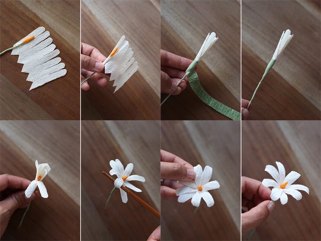 Dán keo lên phần dưới của tờ giấy trắng vừa cắt, quấn vào phần cành có nhụy màu cam và dùng 1 đoạn giấy xanh quấn quanh thành phẩm để tạo đài hoa. Dùng đũa uốn cong cánh hoa.
