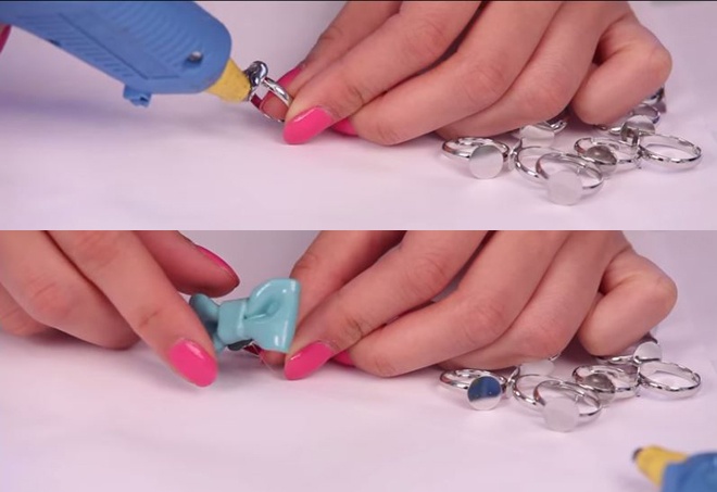 Dùng keo dán nơ lên nhẫn tạo thành những chiếc nhẫn thật tinh nghịch, đáng yêu.
