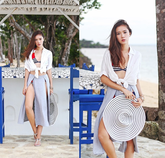 Ngoài ra, buộc gấu áo sơ mi bên ngoài bikini và chân váy maxi cũng tạo ra được kiểu trang phục dạo phố biển đẹp mắt.