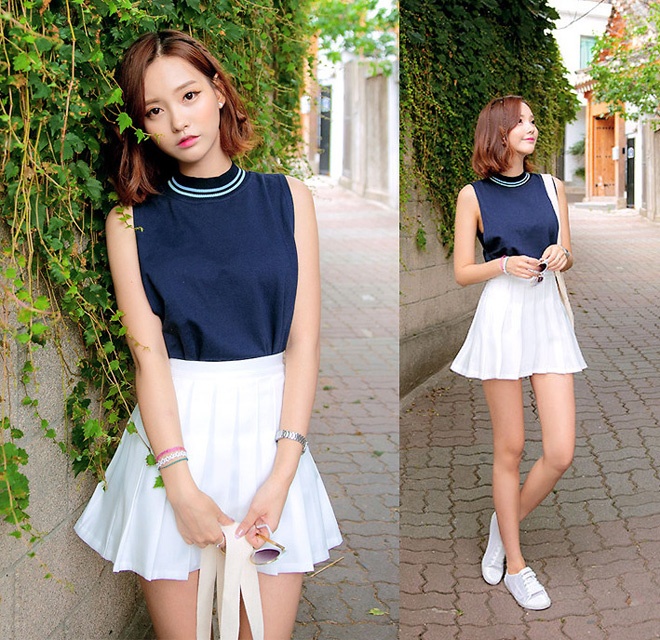 Thanh lịch hơn là áo sát cánh màu xanh coban với váy chữ A trắng, cùng điểm nhấn là đôi giày thể thao năng động.