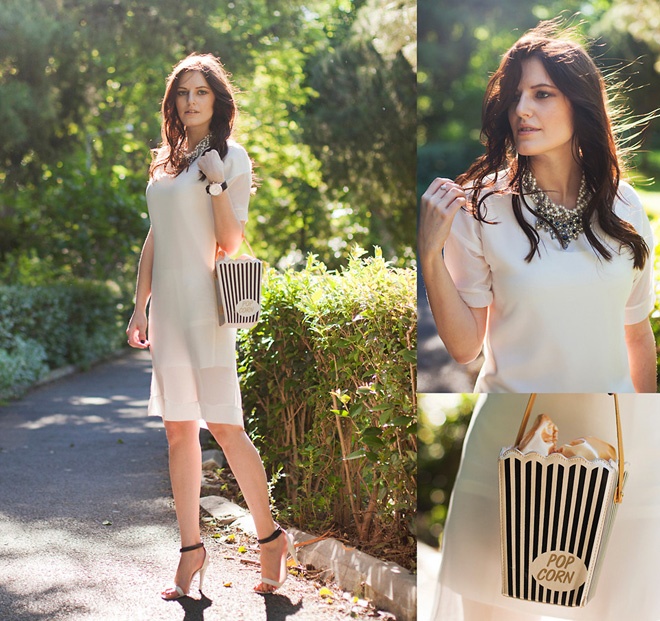 Chiếc đầm trắng đơn giản trở nên độc và đẹp hơn với các phụ kiện “khó đụng hàng” như vòng cổ bản to, túi đeo vai chéo lạ mắt…