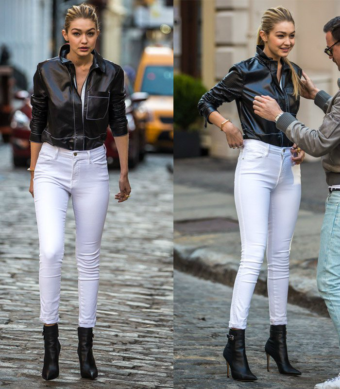 Gigi Hadid rạng rỡ khi mặc một chiếc áo da đen đi kèm với quần skinny trắng.