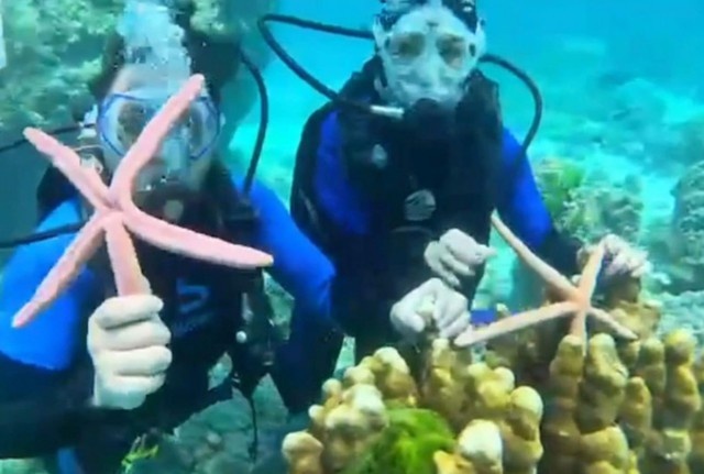 Du khach Trung Quoc doi mat an phat vi chup anh cung san ho hinh anh