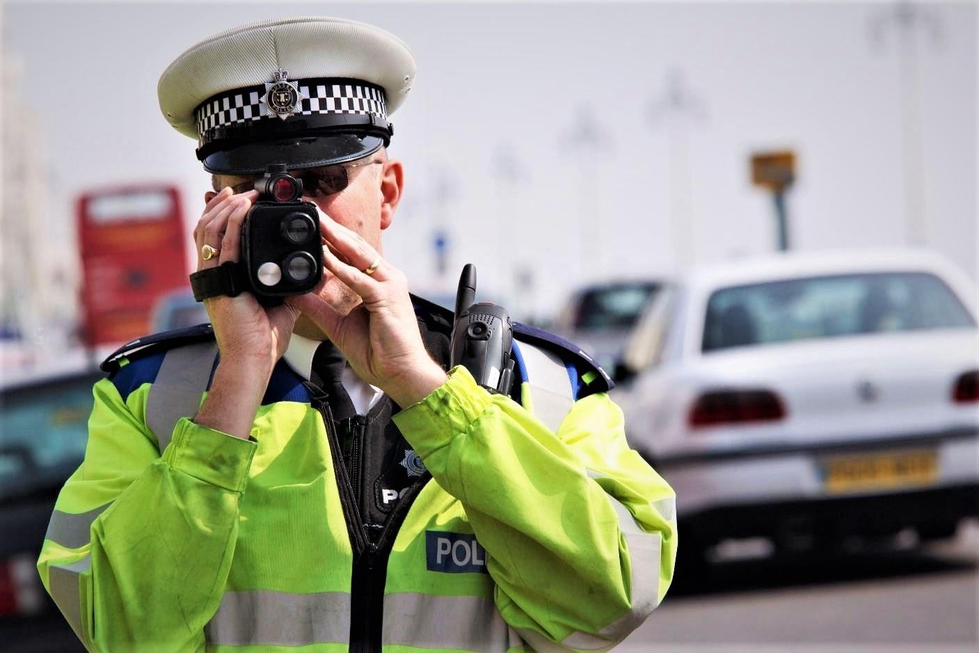 Policeman photo. Speed Camera photos. Speed hold