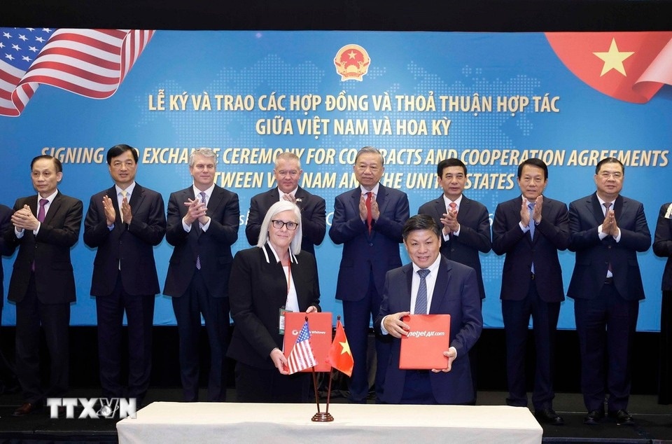 Tong Bi thu chung kien le ky va trao cac thoa thuan hop tac Viet - My hinh anh