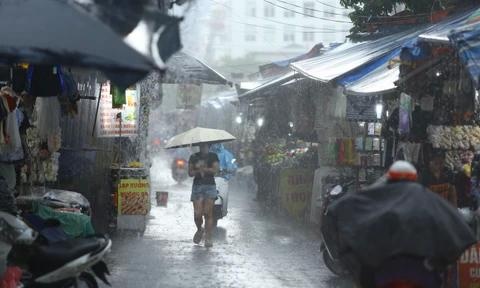 Nhieu khu vuc mien Bac bat ngo hung mua lon hinh anh