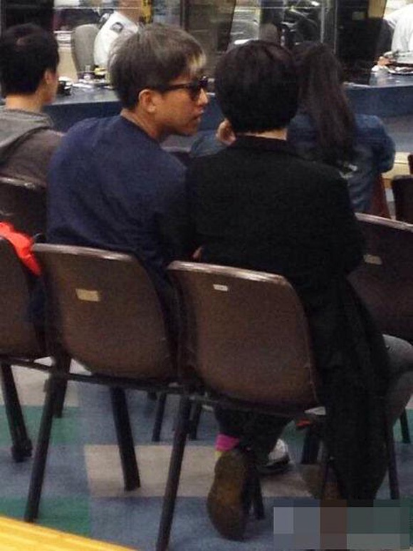 Vợ chồng Tôn Lệ bị bắt gặp ở phòng nhập cư tháng 4/2014.