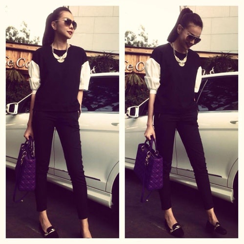 Có đôi khi cô biến tấu thêm sơ mi trắng cho set đồ thêm mới mẻ.