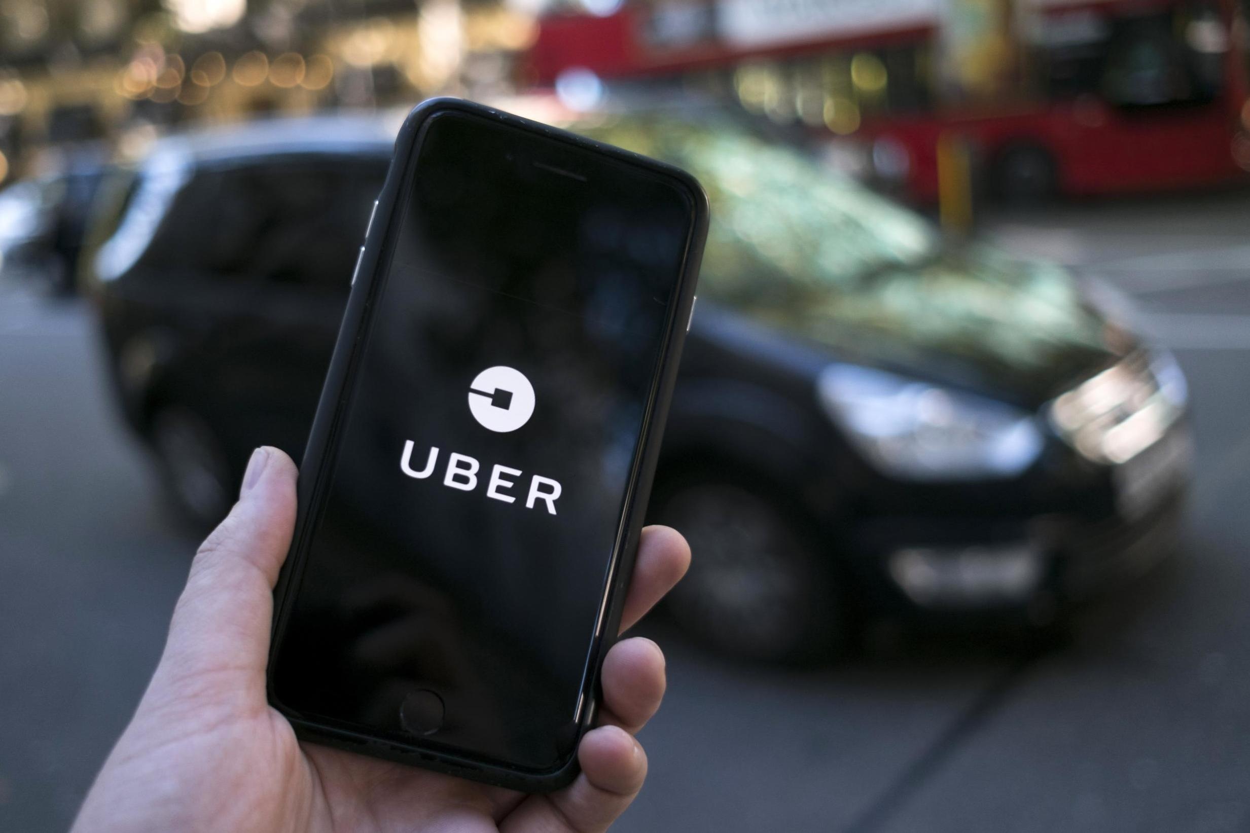 Sap nhap Uber - Grab: Chuyen da roi bat chap nghi van doc quyen? hinh anh