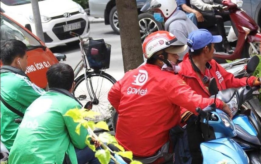 Ai chiu thiet sau cuoc dua ‘dot tien’ cua Go-Viet va Grab? hinh anh
