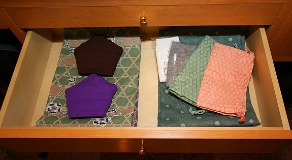 A yukata set consisting of yukata, yukata coat, socks, and obi belts (folded into pentagons)