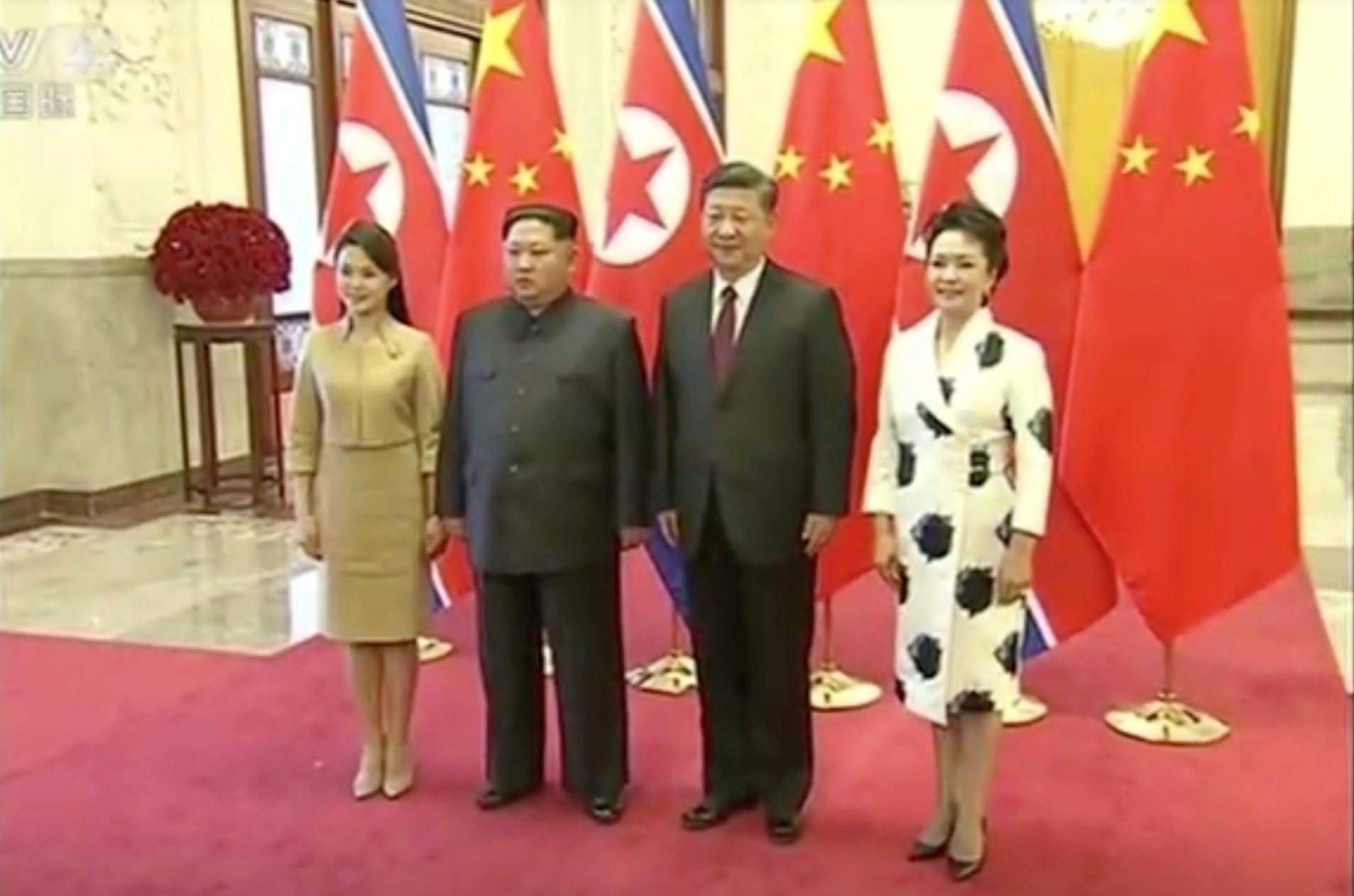 Hinh anh vo chong ong Kim Jong Un toi Bac Kinh hinh anh