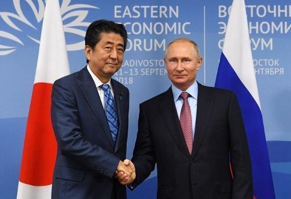 Ong Abe, Putin thao luan de som ky hiep dinh hoa binh hinh anh