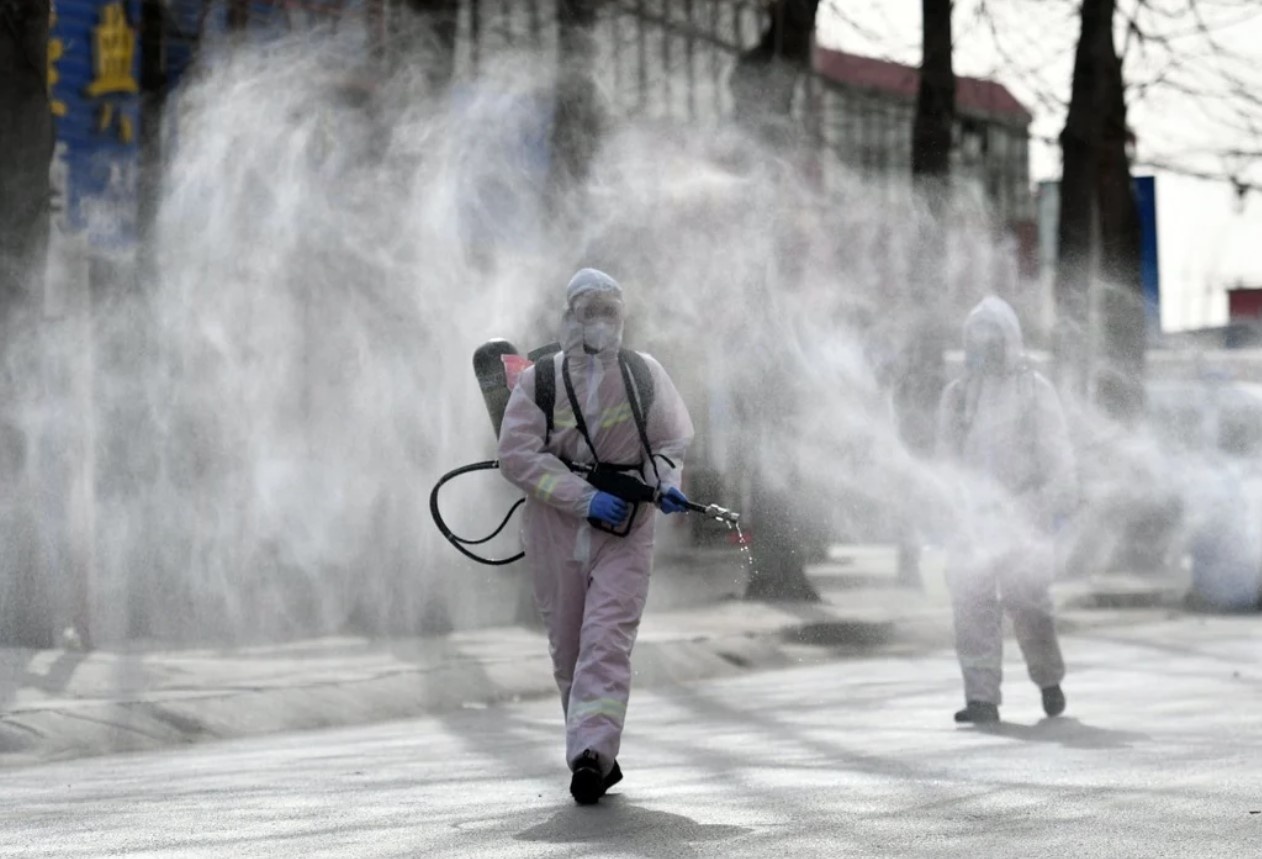 Trung Quoc keo dai lenh phong toa o 3 thanh pho hinh anh